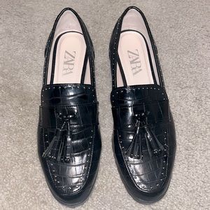 Black croc loafers with front tassel and silver dotted hardware. Worn only once.